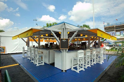 Corona Extra set up its signature beach bar outside the main court completely with bar stools on four sides and TVs showing the matches taking place throughout the day.