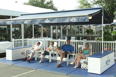 White Adirondack chairs below misters provided tennis-goers a break from the 95-plus degree heat throughout the tournament.