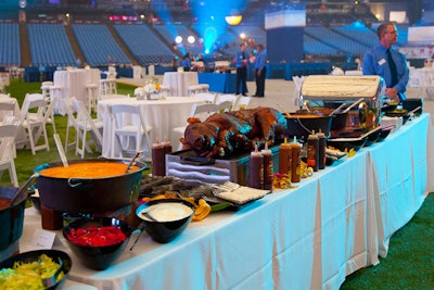 To encourage guests to move around and mingle, organizers set up food stations throughout the field, with offerings like a pulled pork buffet.