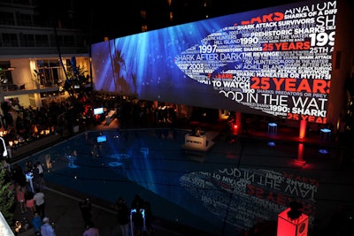 Moving projections on the Beverly Hilton's white wall showed imagery related to Discovery's Shark Week programming.