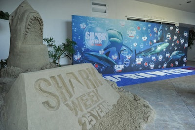 A sand sculpture near the arrivals carpet bore the Shark Week logo and was topped with a detailed likeness of a toothy shark.