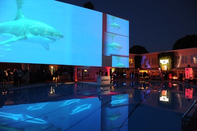 At the event, which was held during the Television Critics Association summer press tour, sharks appeared to stalk slowly about the Beverly Hilton pool, thanks to moving projections.