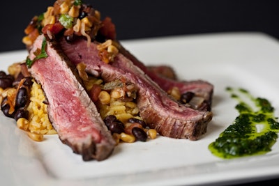 Hispanic culture has had a prominent influence on the Tampa region. Good Food Catering Company will serve grilled, citrus-marinated flank steak, drizzled with cilantro chimichurri and served with yellow rice, black beans, and charred corn salsa.