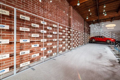 A cutout step-and-repeat wall allowed the exposed brick behind to show through.