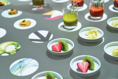 The system can also be used to display hors d'oeuvres. When a guest picks up a small plate, a graphic appears.