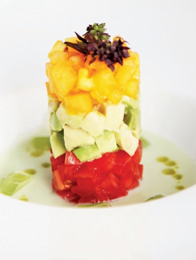 Red and yellow tomato tartare with avocado, white gazpacho, and cucumber geleé by Occasions Caterers in Washington