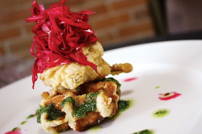 Rosemary-infused waffles served with buttermilk-battered smoked cauliflower, horseradish, pickled cabbage, and wild arugula salsa verde by Daniel et Daniel in Toronto