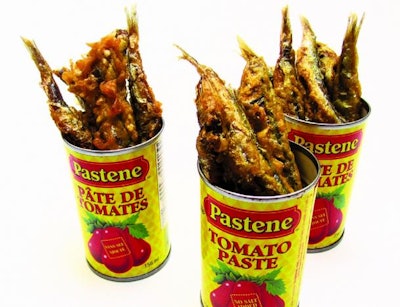 Fried anchovies with sage, rock salt, and truffle aioli served in mini tomato-paste cans by Lindsey Shaw Catering in Toronto