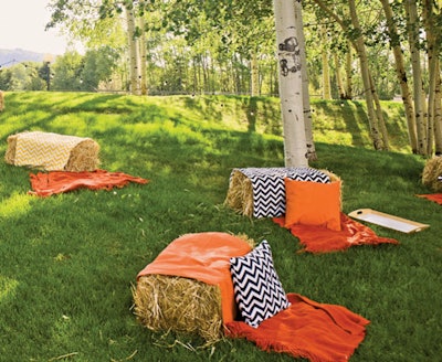 Guests sat on haystacks covered with bright orange blankets and chevron-patterned pillows at a Belvedere-sponsored party during the 2012 Food & Wine Classic in Aspen.