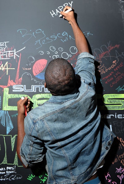 The graffiti wall started with the Pepsi and Billboard Summer Beats logos, and throughout the night attendees were invited to contribute their own messages, drawings, and signatures.