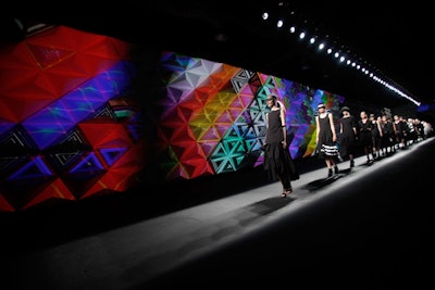 Artist Devan Harlan's 3-D projections marked the runway wall of Y-3's 10th anniversary fashion show on September 9, changing from stark white into acid-bright hues in keeping with the collection. Produced by Villa Eugenie at St. John's Center Studios, models walked the runway to original music by Jiro Amimoto.
