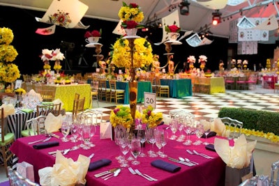 At the Canadian Cancer Society gala, topiaries divided the cocktail reception and dining areas. The eclectic dining room design included five different table centerpieces, seven linen combinations, three types of chairs, and four colors of chair cushion. Giant playing cards hung overhead.