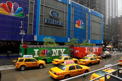 The 2011 NBC upfront used bright colors to grab the attention of passersby. Not only was the Sixth Avenue front of the Hilton New York dressed up for the occasion, NBC also parked double-decker buses custom-wrapped with its logo outside the venue.