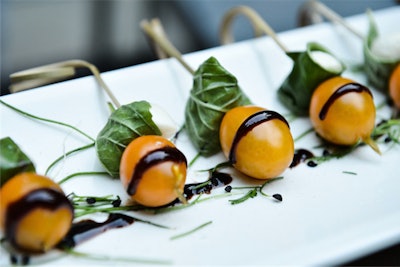 Servers passed skewers of cherry tomatoes, basil, and mozzarella drizzled with balsamic vinegar.