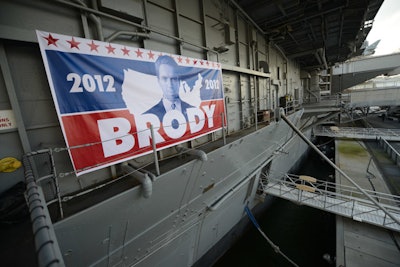 As a nod to the second season's storyline, which involves central character Nicholas Brody running for political office, the television network hung a campaign banner at the entrance to the ship.
