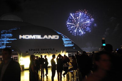 Projections of Homeland's logo and the show's script on the Space Shuttle Pavilion's dome made for striking visuals in the dim light of the evening. Fireworks over the Hudson River kicked off the affair.