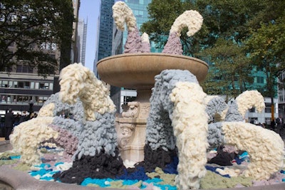 As part of the Campaign for Wool's 'Wool Uncovered' installation, the Bryant Park fountain was drained, and then filled and draped with colorful wool.