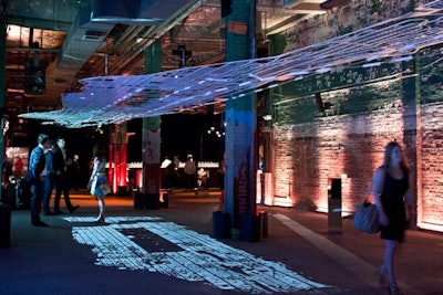 The 'Experiments in Motion' exhibit—a partnership between Audi of America and Columbia University Graduate School of Architecture—comprised a 45-foot-long steel model of the Manhattan subway grid and colorful projections of real-time movement in Manhattan. The piece stood near the event's entrance.