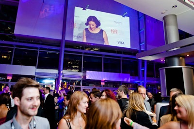 Screens throughout the venues showed live views from the red carpet, film clips, TIFF marketing videos, and festival film previews.