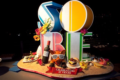 In 2011, the South Beach Wine and Food Festival’s 10th anniversary party, “Let Them Eat Cake,” was hosted by Emeril Lagasse and Martha Stewart. More than 800 guests took elevators to the top floor of event hotspot 1111 Lincoln Road to sip champagne and cocktails and sample confections from a baker’s dozen of pastry chefs alongside the festival’s biggest stars. Top pastry chefs from around the country provided cakes honoring the festival's 10th anniversary.