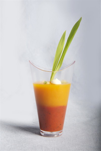 Incorporating the colours of fall, Eatertainment added a mini verrine of yellow and red tomato gazpacho to their menu this season. The hors d'oeuvre is topped with crème fraîche and chives.