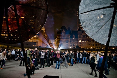 Crowds gathered to watch 'World Without Sun,' which was comprised of eerie video clips showing everything from jellyfish to explosions. The film was projected in Nathan Phillips Square.