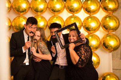 In addition to a flipbook-making booth, Fifth Avenue Digital also set up its YouBooth, a social media-equipped photo booth that let guests share photos online. (The Knot gala was mentioned in more than 500 tweets and retweets.) The backdrop was comprised of gold Mylar balloons.