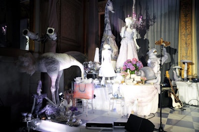 A menagerie of animals and mannequins helped establish the night's concept of allowing guests to 'step through the glass and into [Bergdorf's] windows.' The floor of the stage was decorated with a lavender and white checkerboard pattern.