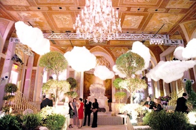 For Bergdorf Goodman's anniversary party, guests gathered for cocktails in the Plaza's Terrace Room before being ushered into the Grand Ballroom. Inside the reception space, the production team placed imported trimmed topiaries amidst the property's gilded ceiling and chandeliers.