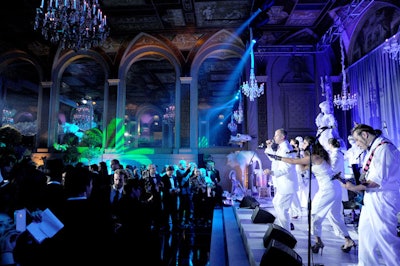 Following the birthday cake presentation, the all-white clad '80s tribute band, Rubik's Cube, performed from the stage, keeping guests dancing late into the night on a high gloss black dance floor.