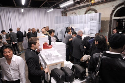 The all-white Maison Martin Margiela for H&M pop-up shop occupied the entire ninth floor with half of the space dedicated to women's items and the other half dedicated to menswear. To allow the guests to enjoy the rest of the night without lugging around their purchases, staffers transported shopping bags to the coat check via a dedicated elevator. Guests could pick up their items as they left the event at the end of the night.