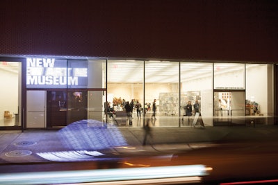 The lobby features a glass wall and streetscape views