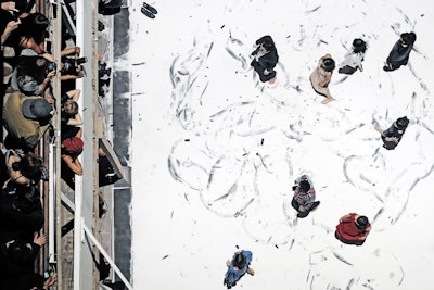 Anna Teresa De Keersmaeker's contemporary dance company, Rosas, staged a custom, nearly two-hour performance that incorporated the Margiela for H&M collection and a 19.7- by 26.25-foot black-colored platform covered with white sand.