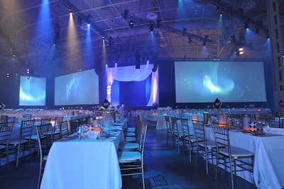 Harvest tables with seats for four to 20 filled the dining room. Six screens hung in the space.