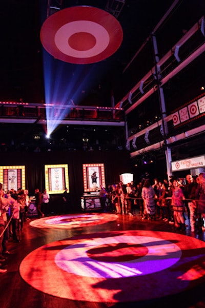 Two Target bull's-eye rugs, each 15 feet in diameter, formed the room's focal point. The pieces served as both a visual cue and a strategic cue: They were the field that the aerialists needed clear in order to execute their performance later in the night.