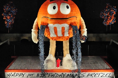 When Mars Chocolate North America commemorated one year since the introduction of M&M's Pretzel, the public party also broke a Guinness World Record for the world's largest piñata. Standing 46 feet tall in New York's 69th Regiment Armory, the papier-mâché-clad replica of the orange M&M's Pretzel character—referred to by the brand as a 'spokescandy'—held thousands of bags of the chocolate sweets, which were released and distributed to the audience.
