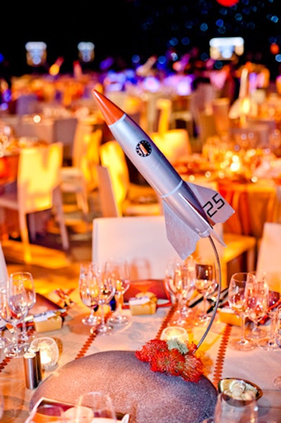 Retro rocket ships acted as centrepieces in the dining room. Red and orange flowers created a 'flame' at the base, which flashed.