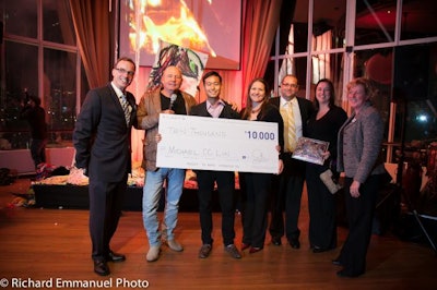 Host Mike Bullard, along with Atlantis staff, presented prizes to the winning guests. Pictured here are grand-prize winner Michael CC Lin from Giannone Petricone Associates Inc. Architects with his $10,000 cheque for an event at Atlantis, and Sandra Della-Morra from Maritz, with her trip for two to Las Vegas for three nights.