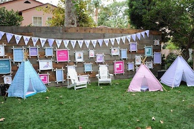 Kid-sized teepees sat beneath a banner that announced 'Camp Little Maven.'