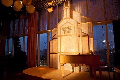 A.Bunch fashioned the bottle-shaped backdrop for the stage at Top of the Standard.