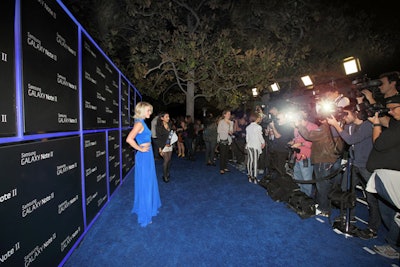 In the blue carpet arrivals area, LED tubes bordered logos to comprise a custom press wall.