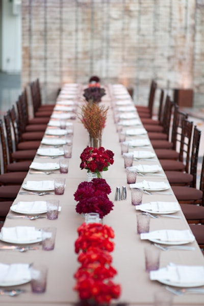 A single type of flower or foliage, all in fall colors, filled each vessel.