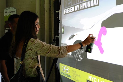 Go Graffiti's digital spray paint allowed attendees at the 'Re:Mix Lab' to customize images of the new Hyundai cars.