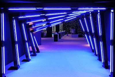 Matching the blue used in the Turner Media Plus graphics, Triton Productions fashioned a brightly illuminated entrance tunnel that led to the reception inside Jazz at Lincoln Center's atrium. The structure placed by the elevator effectively hid other parts of the venue, directing guests to the designated space.