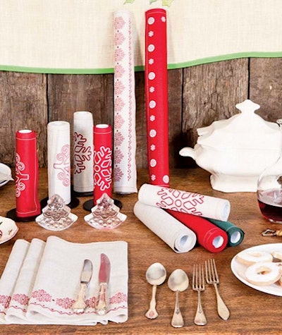 MYdrap cotton napkins and place mats come on a perforated roll. Each place mat roll, $40, includes 12 recyclable squares that can be torn off or kept connected to create a table runner. The holiday collection features snowflake and tree patterns.