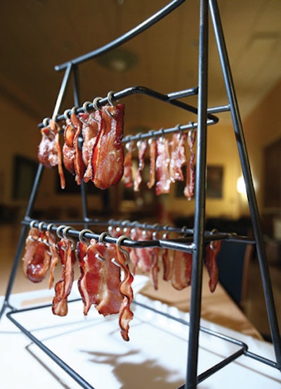 At the MSNBC party after the White House Correspondents’ Dinner, Occasions Caterers served crisp bacon on tiny hooks attached to a metal structure.