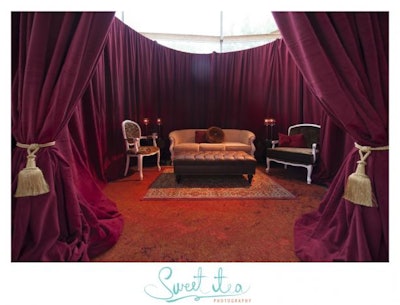 Next, guests entered a space inspired by the novel's Red Room of Pain. This luxurious space featured private, peekaboo lounges with burgundy drape and gold tassels.