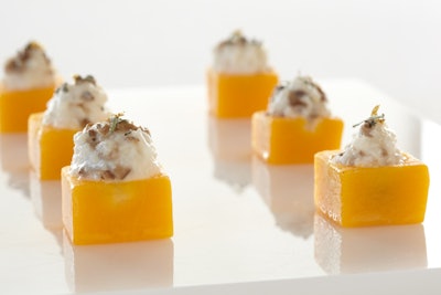 Gold-dusted risotto served in butternut squash cups, by Boutique Bites Catering and Events in Chicago