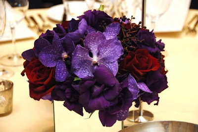 Organica created the gala's centerpieces, which featured purple Vanda orchids and red roses in mirrored vases.