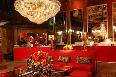 Make sure guests have a place to relax by setting up a festive all-red lounge area, complete with red plexi bars, red sofas, and red Charles Ghost barstools, all available to rent from Contemporary Furniture Rentals Inc.